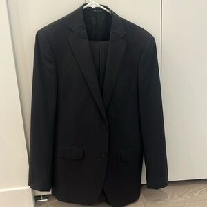Black Calvin Klein 2-piece suit. 40R jacket, 32/32 pants